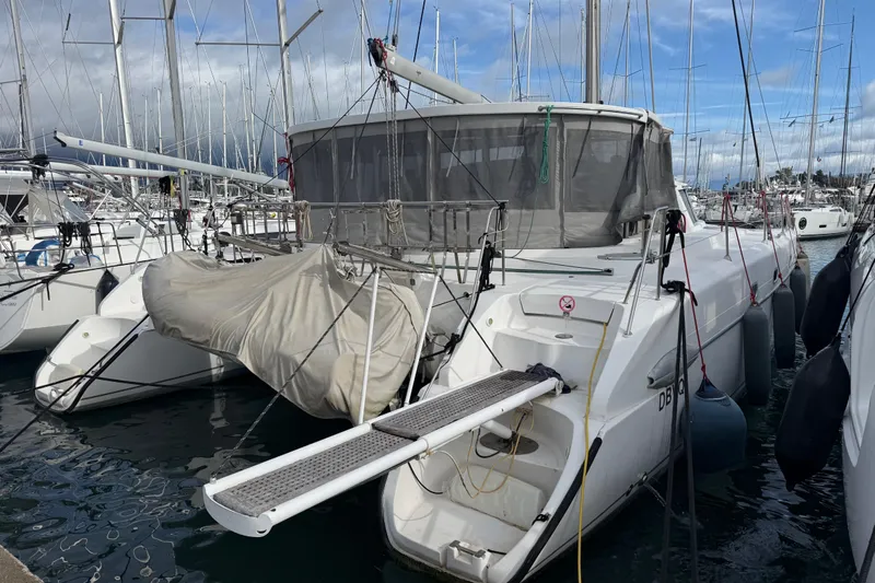  Yacht Photos Pics 2003 Fountaine Pajot Belize 43 catamaran docked in a marina, surrounded by other boats.