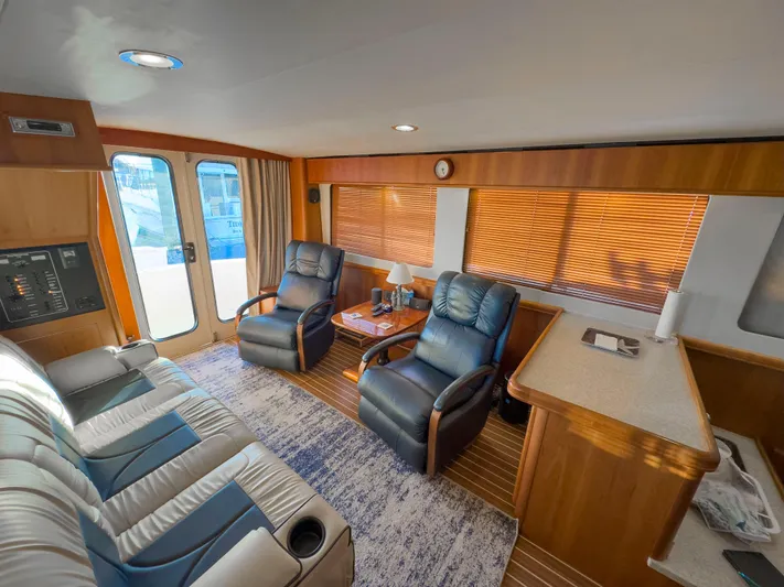 Vitamin Sea Yacht Photos Pics Interior of 2005 Mainship 34 Trawler with leather seating and wooden accents.