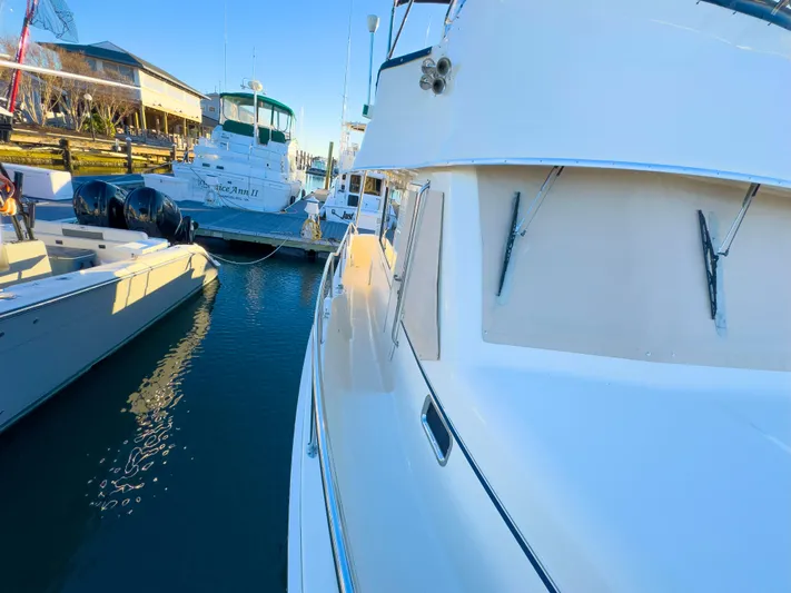 Vitamin Sea Yacht Photos Pics 2005 Mainship 34 Trawler docked at marina, surrounded by other boats.