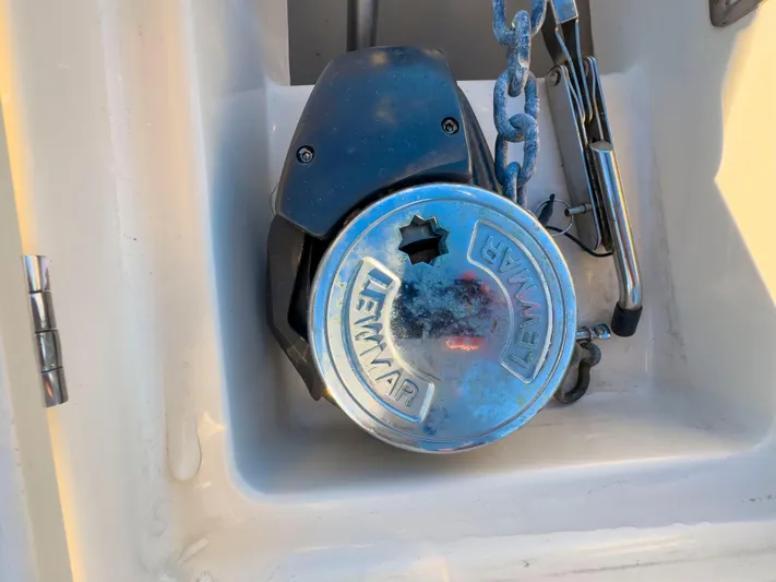 Vitamin Sea Yacht Photos Pics Lewmar windlass on 2005 Mainship 34 Trawler, with anchor chain visible.