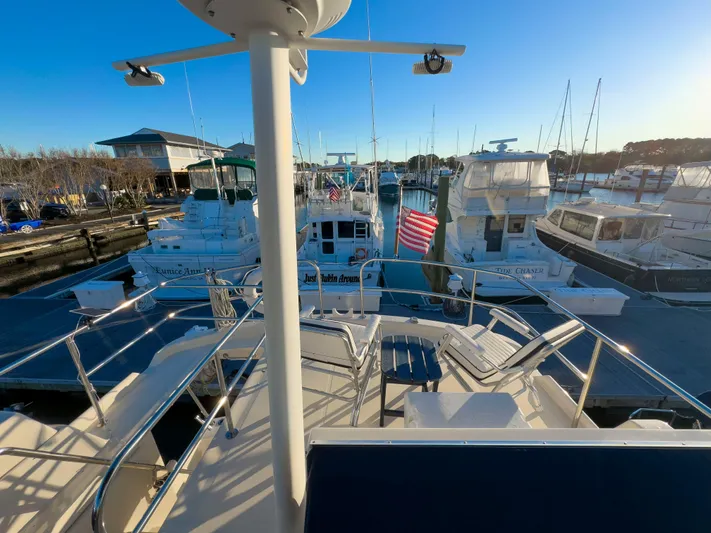 Vitamin Sea Yacht Photos Pics 2005 Mainship 34 Trawler docked at marina with other boats, sunny day.