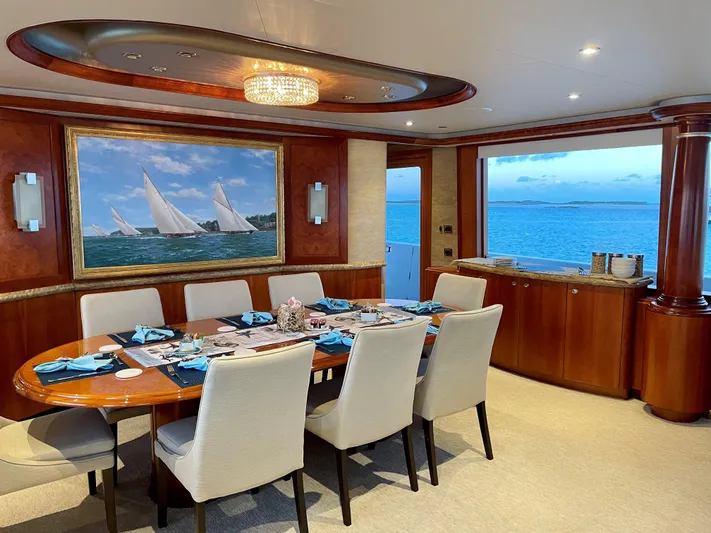 Relentless Yacht Photos Pics Luxurious dining area on 2006 Westport Tri-Deck Motoryacht.