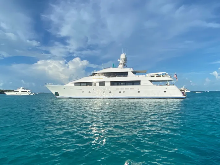 Relentless Yacht Photos Pics 2006 Westport Tri-Deck Motoryacht on blue ocean waters.