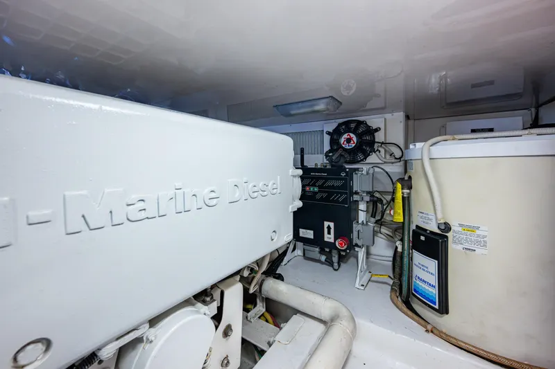 Sweet Melissa Yacht Photos Pics Engine room of 2004 Viking 48 Convertible yacht with marine diesel components.