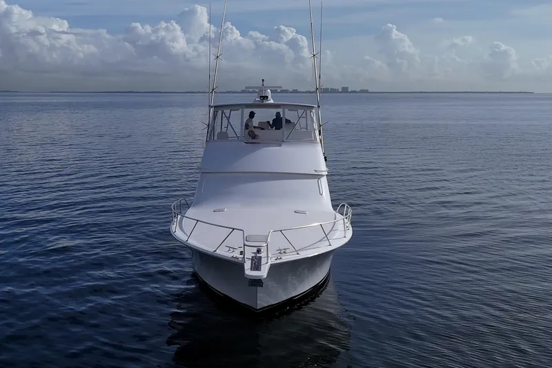 Sweet Melissa Yacht Photos Pics 2004 Viking 48 Convertible yacht cruising on calm ocean waters.