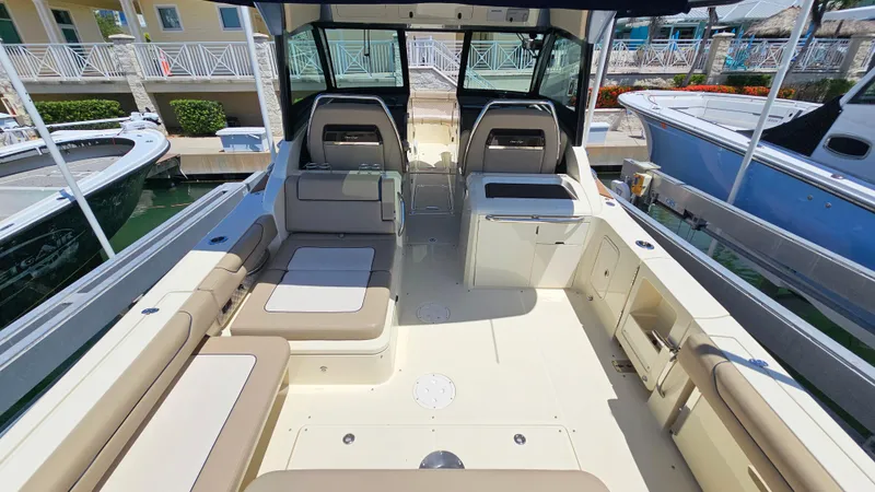  Yacht Photos Pics 2022 Chris-Craft Calypso 35 boat interior with beige seating and modern design.