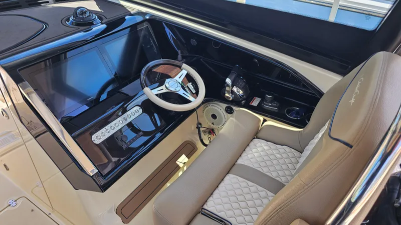  Yacht Photos Pics 2022 Chris-Craft Calypso 35 helm with modern steering wheel and control panel.