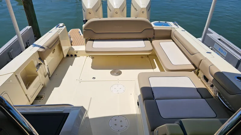  Yacht Photos Pics 2022 Chris-Craft Calypso 35 boat interior with beige seating and outboard motors.