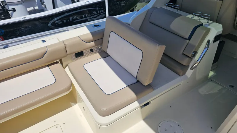  Yacht Photos Pics 2022 Chris-Craft Calypso 35 boat interior with beige and white seating.