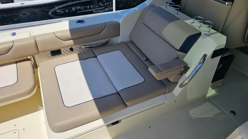  Yacht Photos Pics 2022 Chris-Craft Calypso 35 boat interior with beige seating and cup holders.