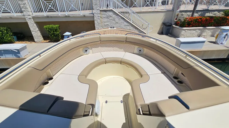  Yacht Photos Pics 2022 Chris-Craft Calypso 35 boat with spacious seating and elegant design at a dock.