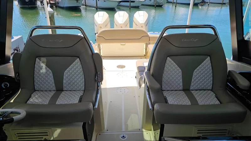  Yacht Photos Pics 2022 Chris-Craft Calypso 35 boat interior with luxurious seating and triple outboard engines.