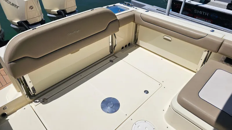  Yacht Photos Pics 2022 Chris-Craft Calypso 35 boat interior with beige seating and outboard motors.