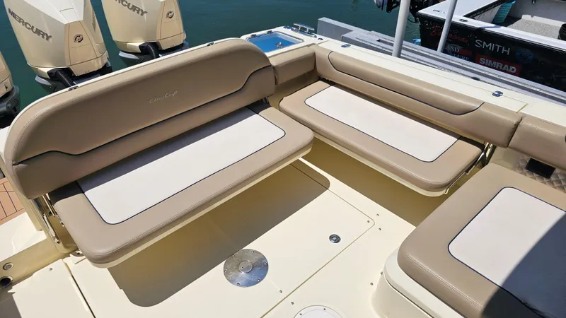  Yacht Photos Pics 2022 Chris-Craft Calypso 35 boat seating area with beige cushions and Mercury engines.