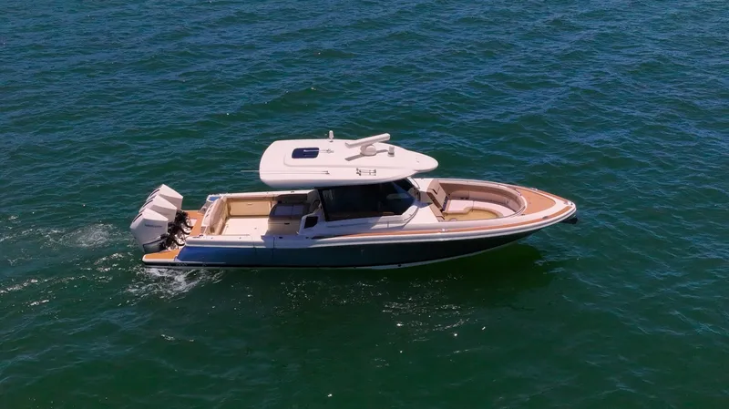  Yacht Photos Pics 2022 Chris-Craft Calypso 35 boat cruising on open water.