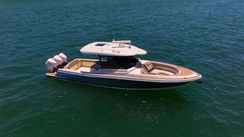  Yacht Photos Pics 2022 Chris-Craft Calypso 35 boat on open water, showcasing sleek design and powerful engines.