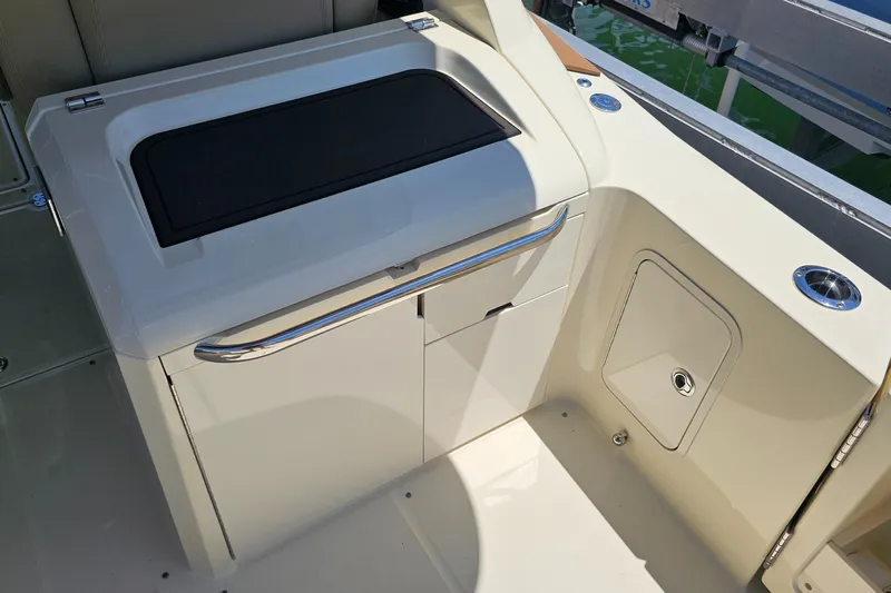  Yacht Photos Pics 2022 Chris-Craft Calypso 35 boat interior with sleek cabinetry and storage compartments.
