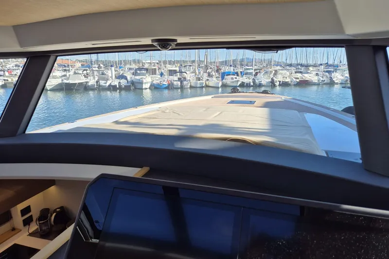  Yacht Photos Pics Interior view from 2023 Pardo Yachts GT52, overlooking marina with docked boats.
