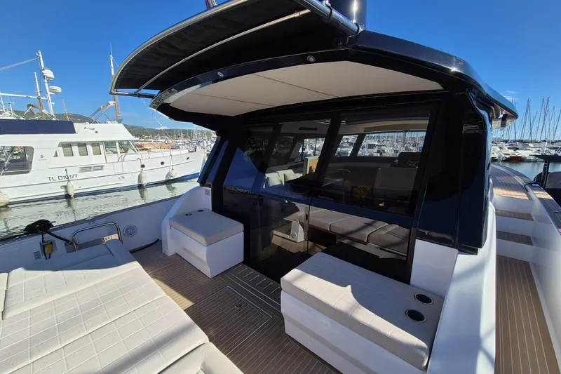  Yacht Photos Pics 2023 Pardo Yachts GT52 luxury yacht interior with seating, docked at marina.