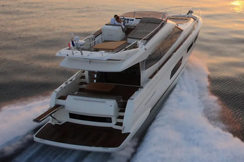  Yacht Photos Pics Manufacturer Provided Image: 2016 Prestige 550 yacht cruising at sunset.