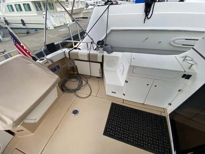  Yacht Photos Pics 2015 Cutwater C-28 boat deck with storage compartments and American flag.