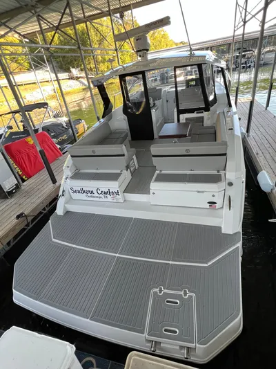 Southern Comfort Yacht Photos Pics 2022 Cruisers Yachts 390 Express Coupe docked, featuring spacious deck and seating.