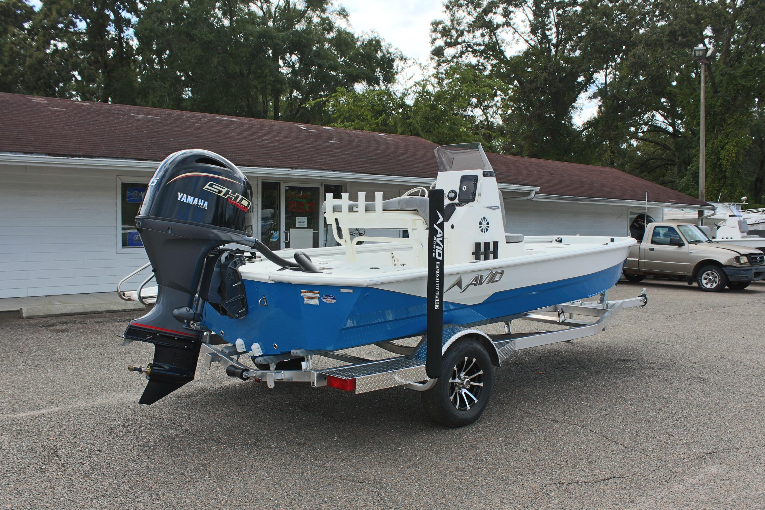 2026 Avid 19 FSX boat with Yamaha engine on trailer, parked outdoors.