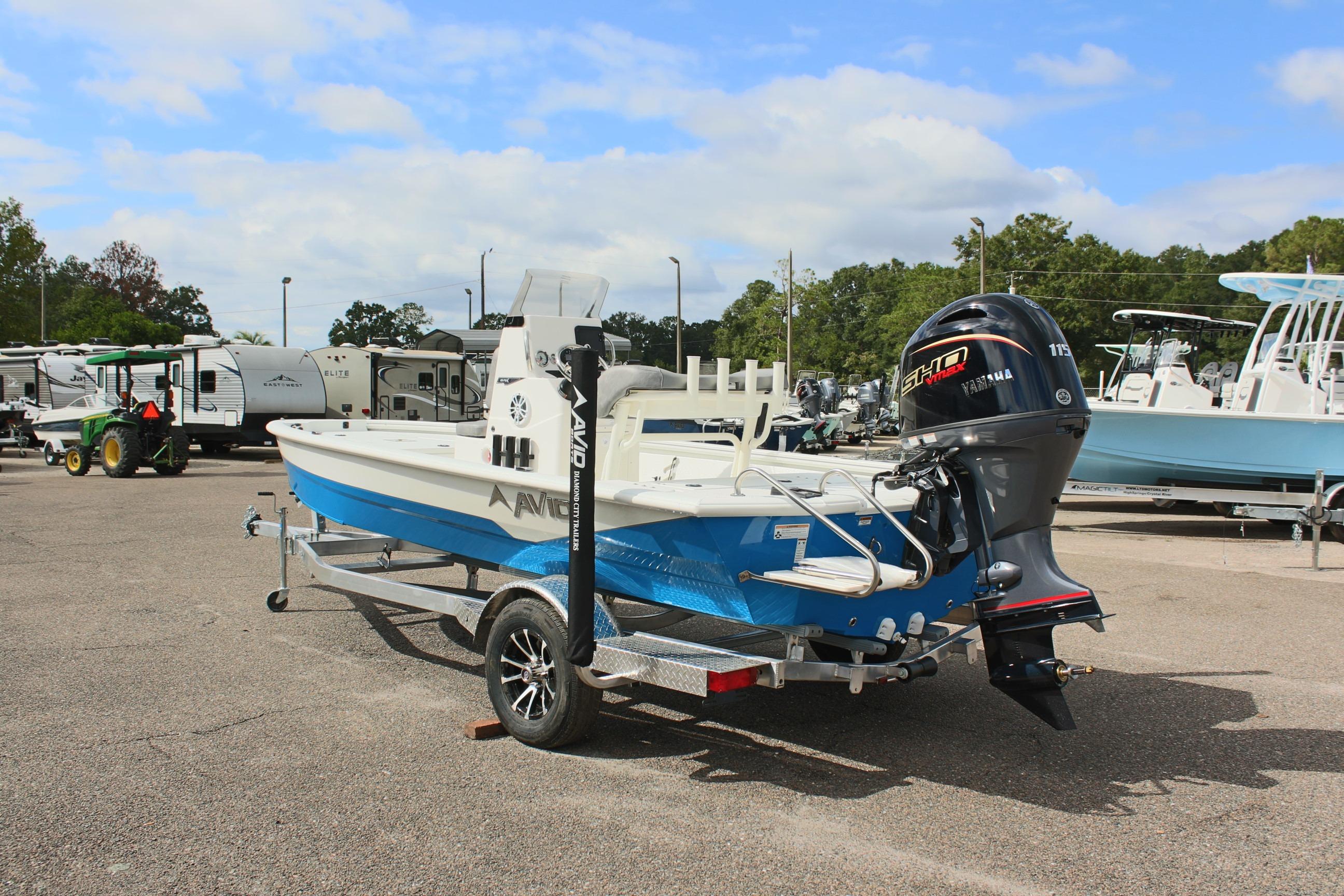 2026 Avid 19 FSX boat with Yamaha motor on trailer in parking lot.
