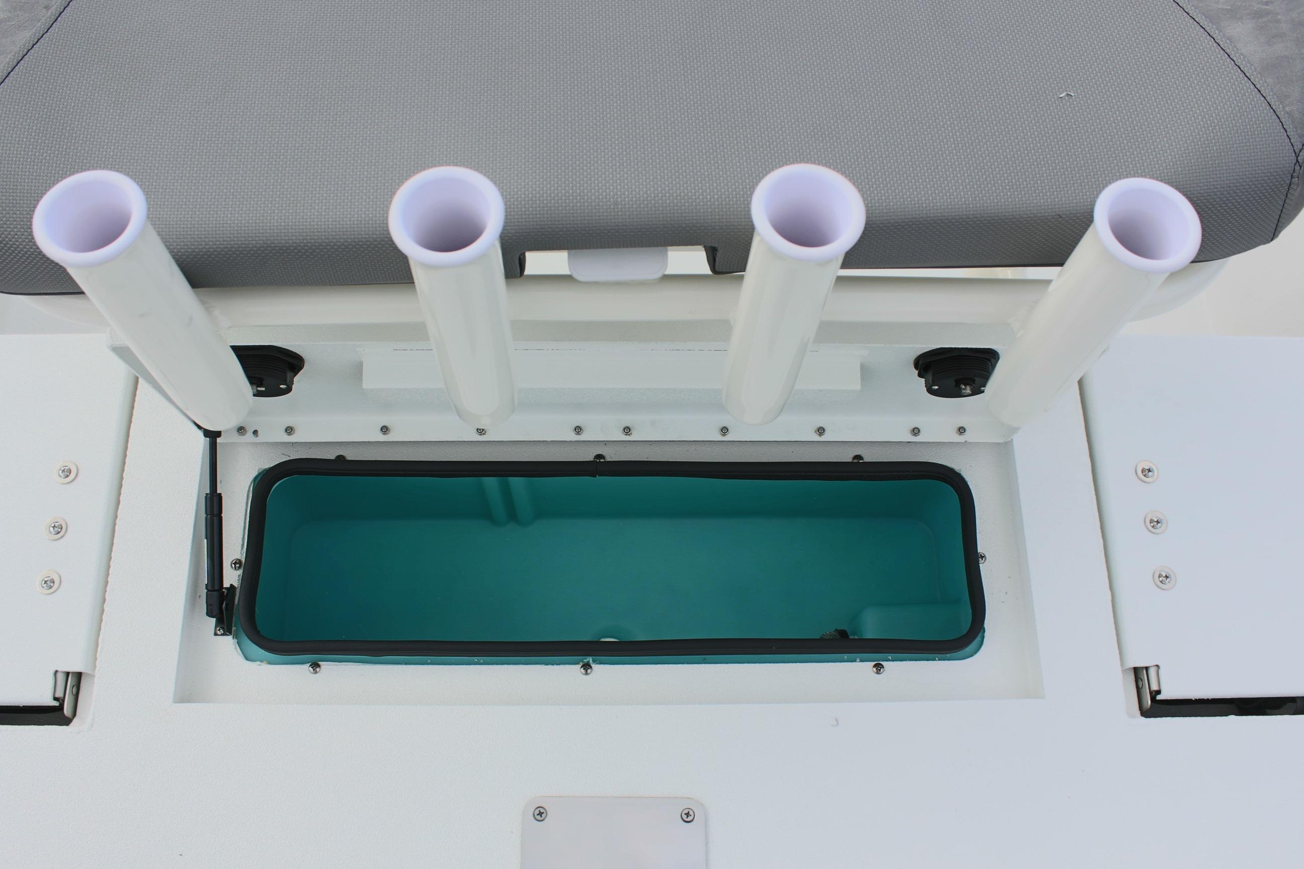 Avid 19 FSX 2026 boat with rod holders and storage compartment.
