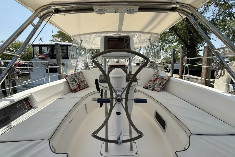  Yacht Photos Pics 2005 Hunter 46LE yacht cockpit with steering wheel and navigation equipment.