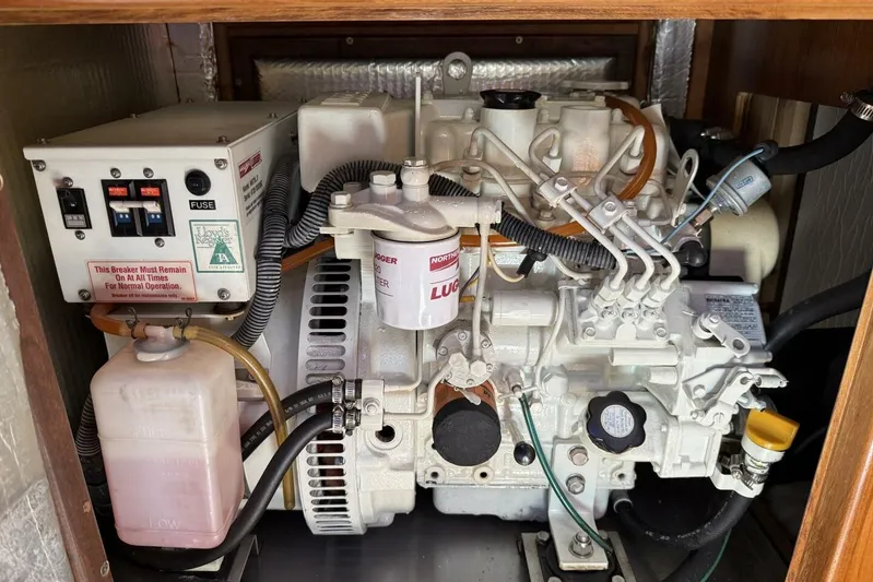  Yacht Photos Pics Engine compartment of a 2005 Hunter 46LE, showcasing detailed mechanical components and wiring.