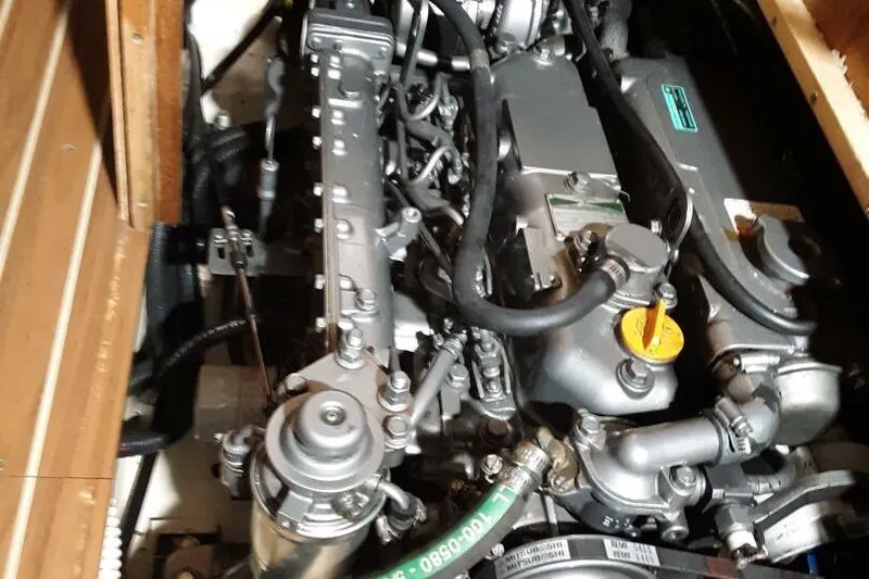  Yacht Photos Pics Engine compartment of a 2005 Hunter 46LE sailboat, showcasing detailed mechanical components.