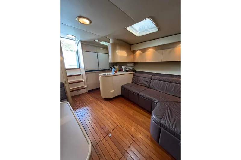 Possibilities Yacht Photos Pics Luxurious interior of 1992 Tiara Yachts 4300 Open with wooden flooring and leather seating.