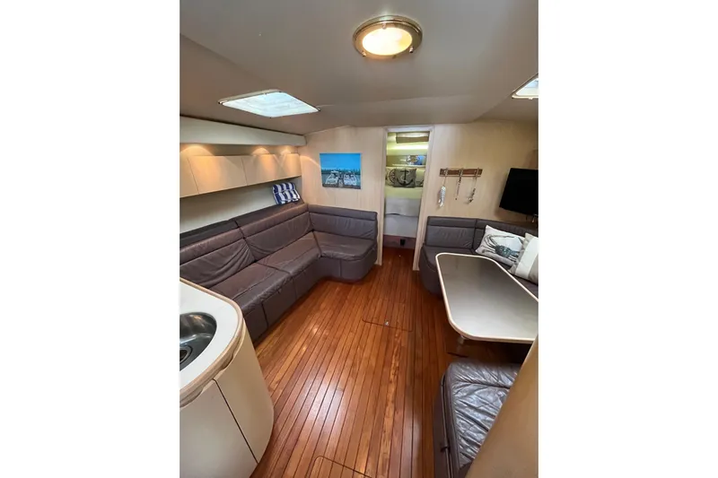 Possibilities Yacht Photos Pics Interior of 1992 Tiara Yachts 4300 Open with wood flooring and leather seating.