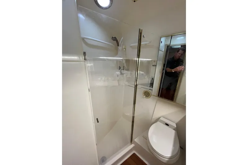 Possibilities Yacht Photos Pics Bathroom interior of 1992 Tiara Yachts 4300 Open, featuring shower and toilet.