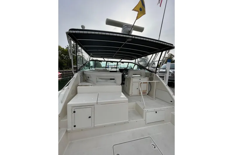 Possibilities Yacht Photos Pics 1992 Tiara Yachts 4300 Open boat interior with seating and canopy.