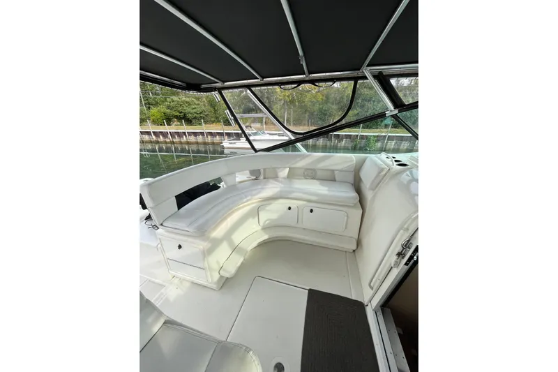 Possibilities Yacht Photos Pics 1992 Tiara Yachts 4300 Open interior with white seating and canopy.
