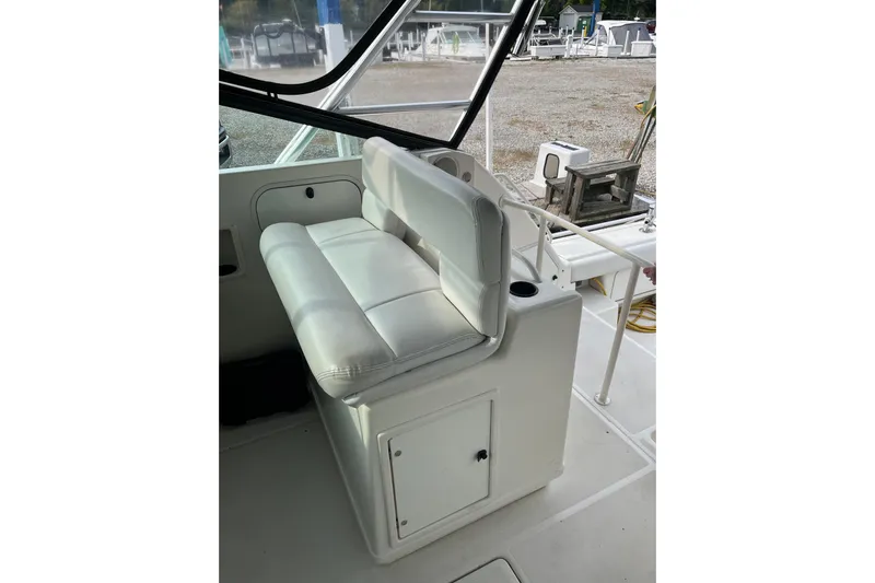 Possibilities Yacht Photos Pics 1992 Tiara Yachts 4300 Open interior with white cushioned seating and storage.