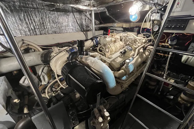 Possibilities Yacht Photos Pics Engine room of a 1992 Tiara Yachts 4300 Open, featuring a well-maintained engine.