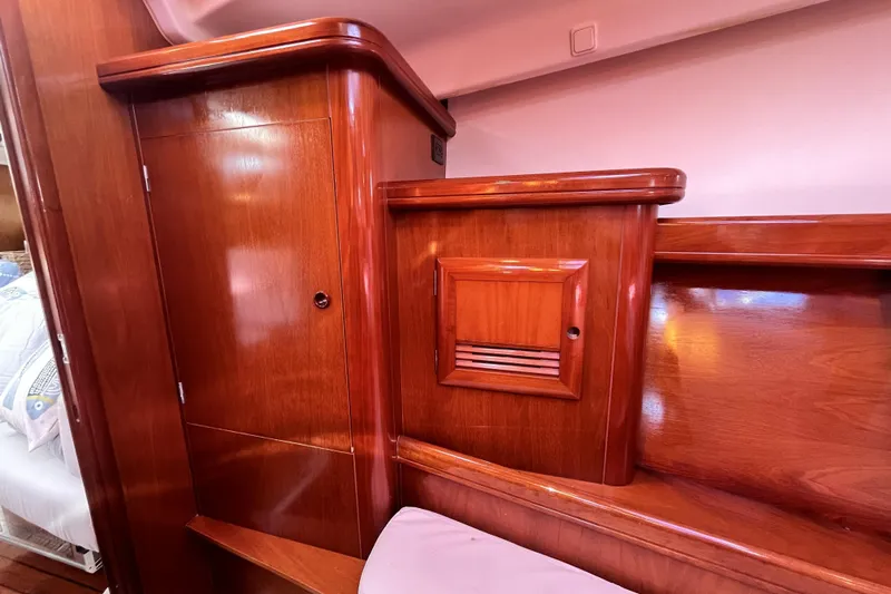 Windnsea Yacht Photos Pics Wooden interior of 2001 Beneteau 473 yacht, featuring polished cabinetry and elegant design.