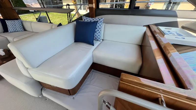 Sea Sea Elle Yacht Photos Pics Luxurious interior seating on a 2019 Princess F62 yacht with elegant cushions.