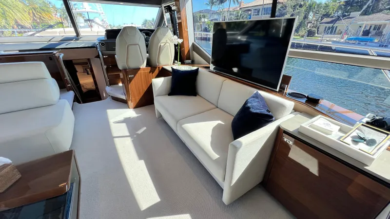Sea Sea Elle Yacht Photos Pics Luxurious interior of 2019 Princess F62 yacht with sofa and TV.