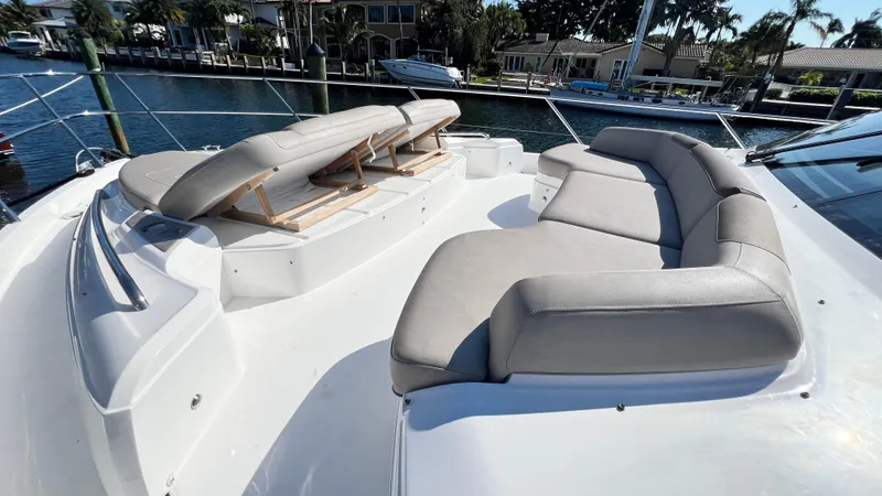 Sea Sea Elle Yacht Photos Pics Luxurious seating on 2019 Princess F62 yacht deck, docked in a serene marina.