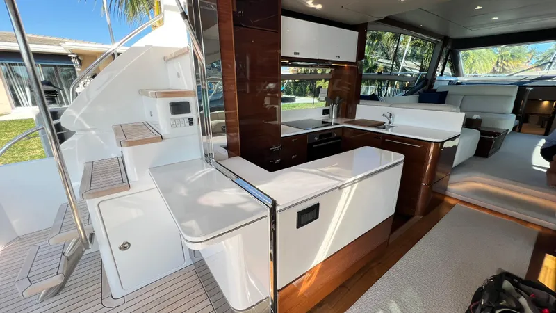 Sea Sea Elle Yacht Photos Pics Luxurious interior of 2019 Princess F62 yacht with modern kitchen and seating area.