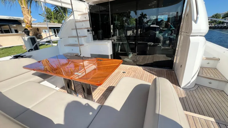 Sea Sea Elle Yacht Photos Pics Luxury yacht Princess F62 2019, featuring elegant outdoor seating and polished wooden table.