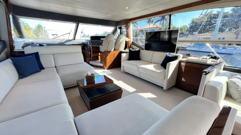 Sea Sea Elle Yacht Photos Pics Luxurious interior of 2019 Princess F62 yacht with modern seating and large windows.