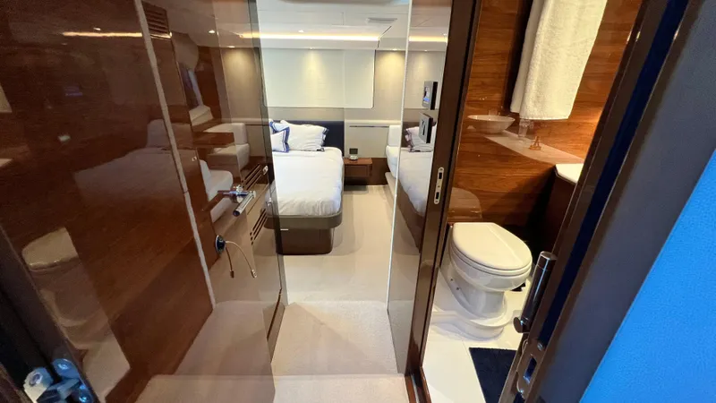 Sea Sea Elle Yacht Photos Pics Luxurious interior of 2019 Princess F62 yacht featuring bedroom and bathroom.