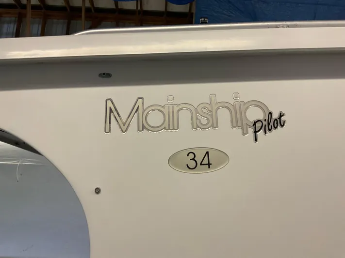  Yacht Photos Pics 2000 Mainship Pilot 34 boat logo on white hull.
