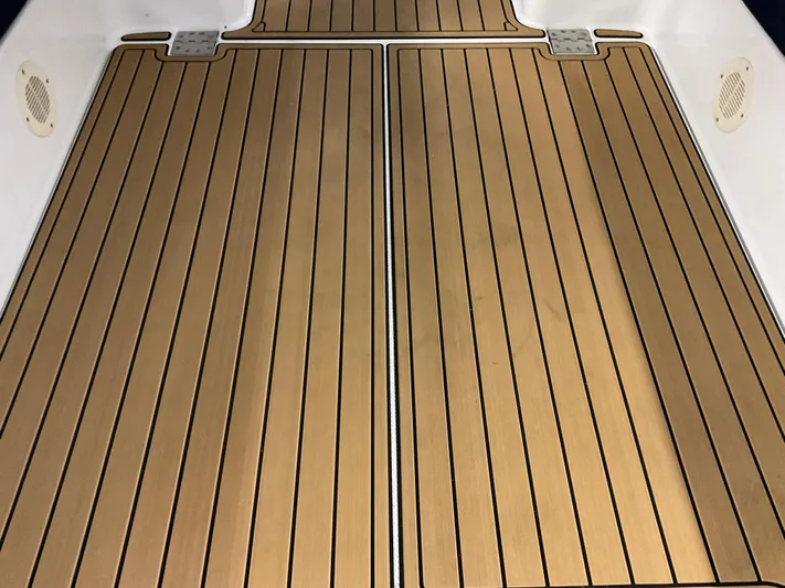  Yacht Photos Pics Teak deck of 2000 Mainship Pilot boat, featuring sleek, parallel lines and durable construction.