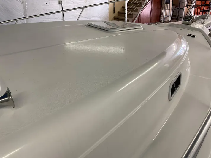  Yacht Photos Pics 2000 Mainship Pilot boat deck with railing and hatch, indoors.